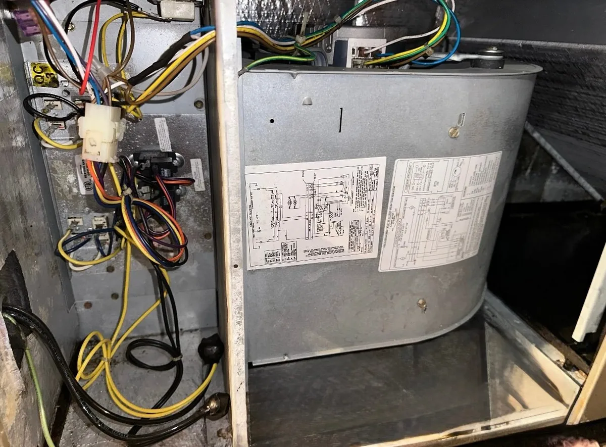 Technician cleaning HVAC system