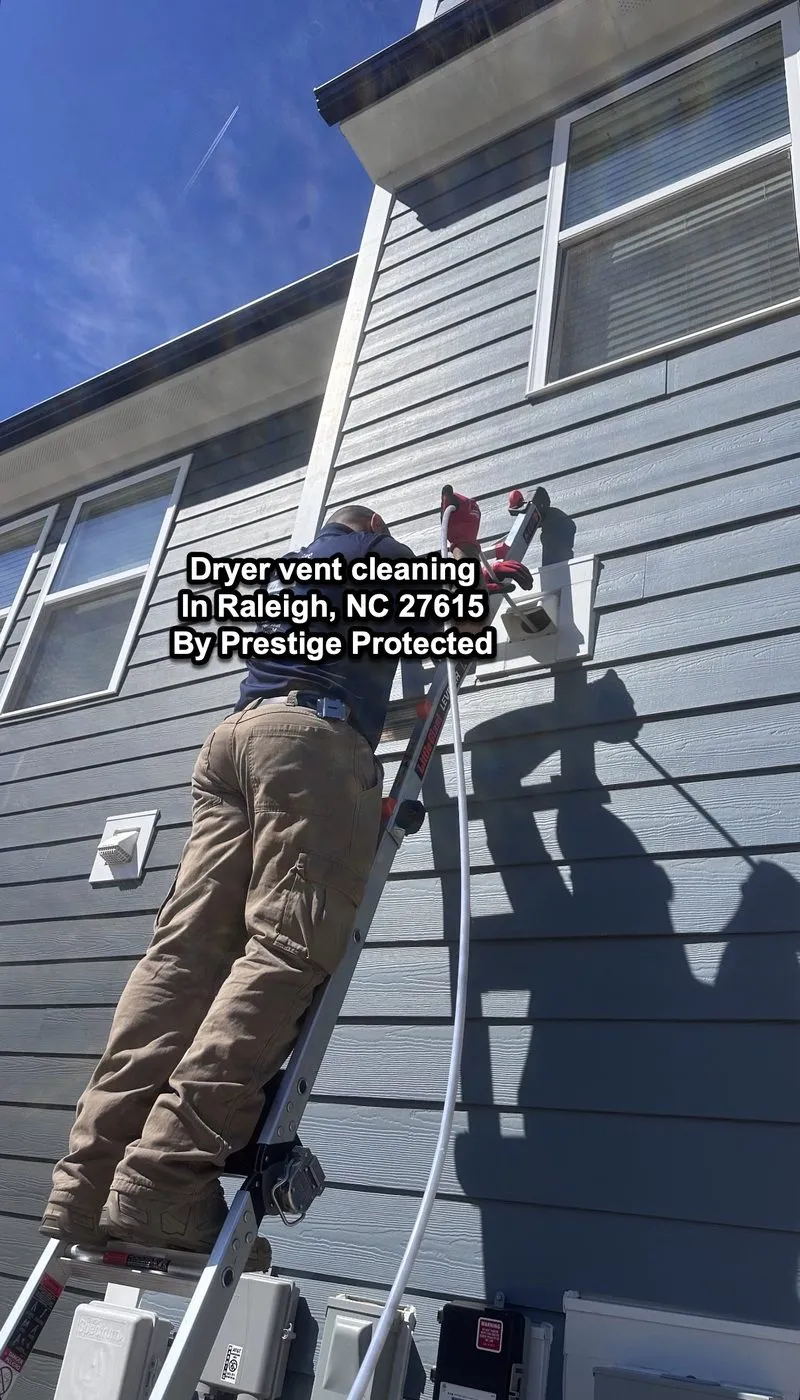 Prestige Protected technician cleaning a dryer vent in Raleigh, NC