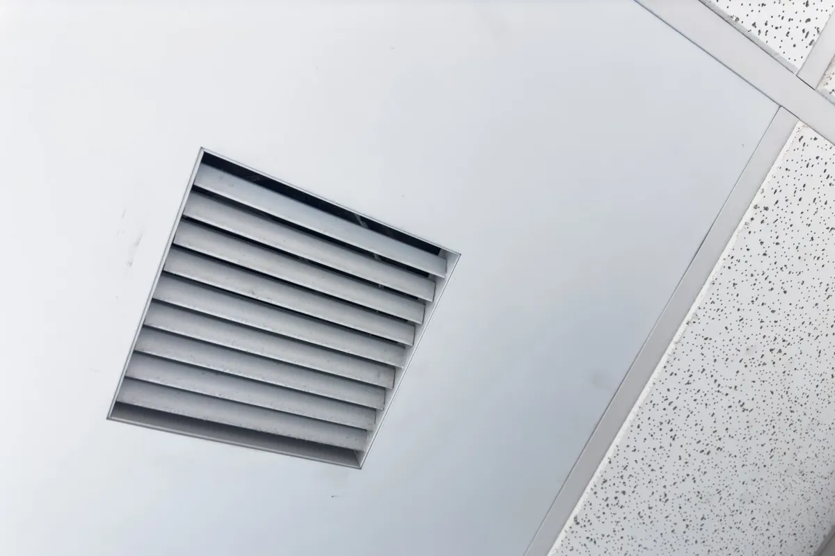 Closeup of clean metal ductwork in a modern air ventilation system promoting healthier indoor air.